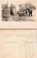 1915 - Edward Scheele pumping up car tire.jpg