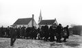 1927 - Alfred Baur Funeral - Carrying Casket to Graveyard - House and Church in Background.jpg