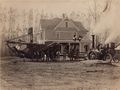 1905 - New Jaus Farrmhouse with steam tractor and threshing machine.jpg